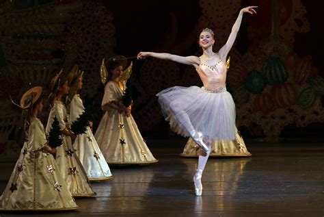 what is the meter of dance of the sugar plum fairy? how does the story of the Nutcracker ballet reflect cultural values?